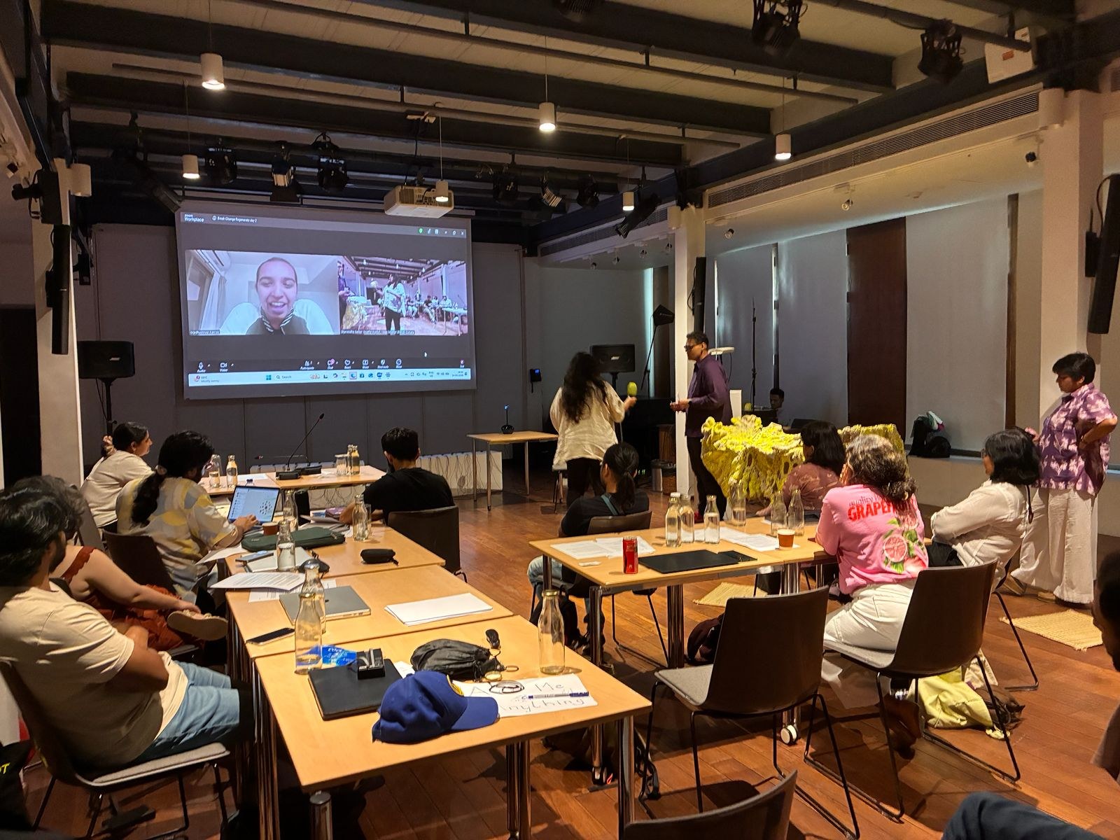 Participants at a BreAIk, ChAInge, RegenerAIte session, with a speaker joining on screen